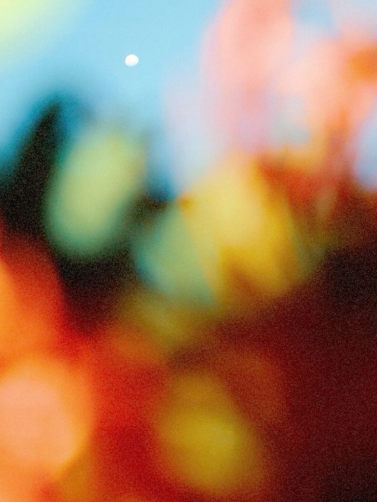 Sun-drenched bokeh of orange and blue light over Gozo at golden hour